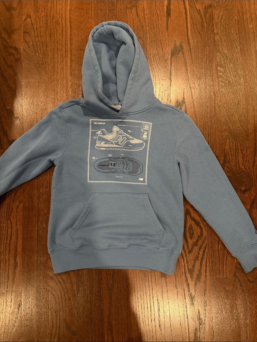 New Balance kids Pale Blue Hoodie with Sneaker Graphic